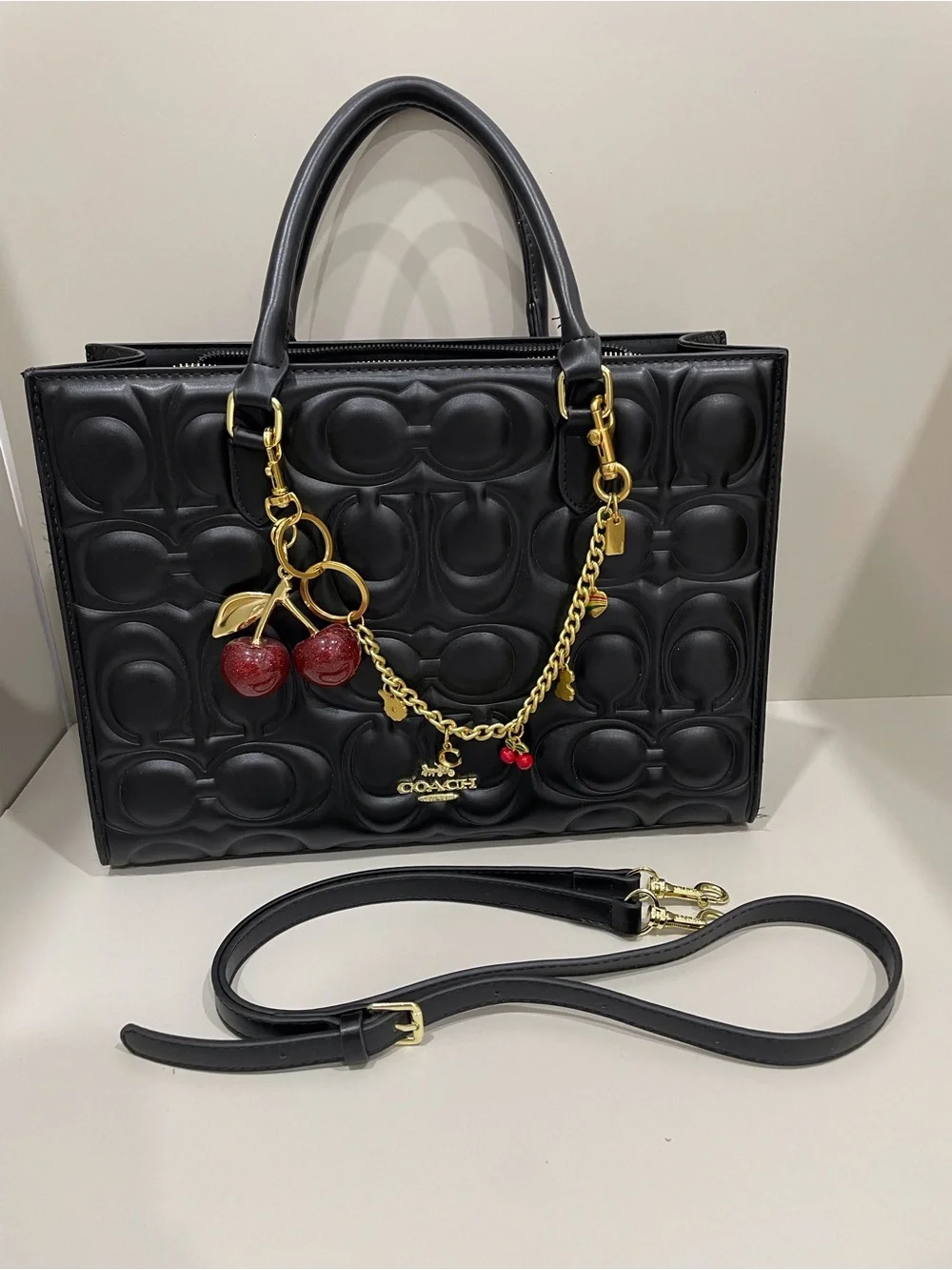 Coach Black Signature Embossed Leather Tote with Cherry Charm